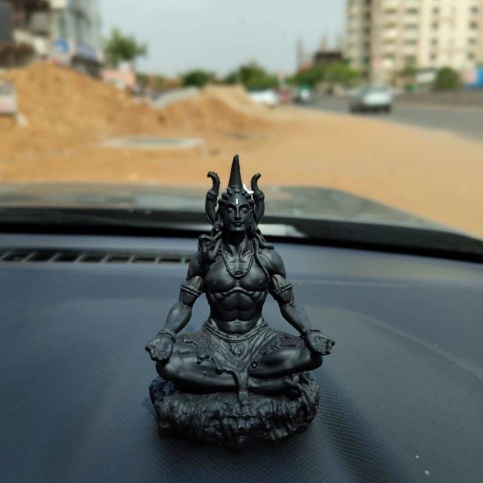 Adiyogi Meditation Statue placed on a car dashboard, ideal for spiritual car decor and compact dashboard sculpture display.